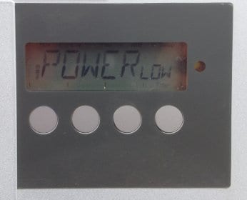 A Fronius IG solar inverter showing a POWER LOW fault code